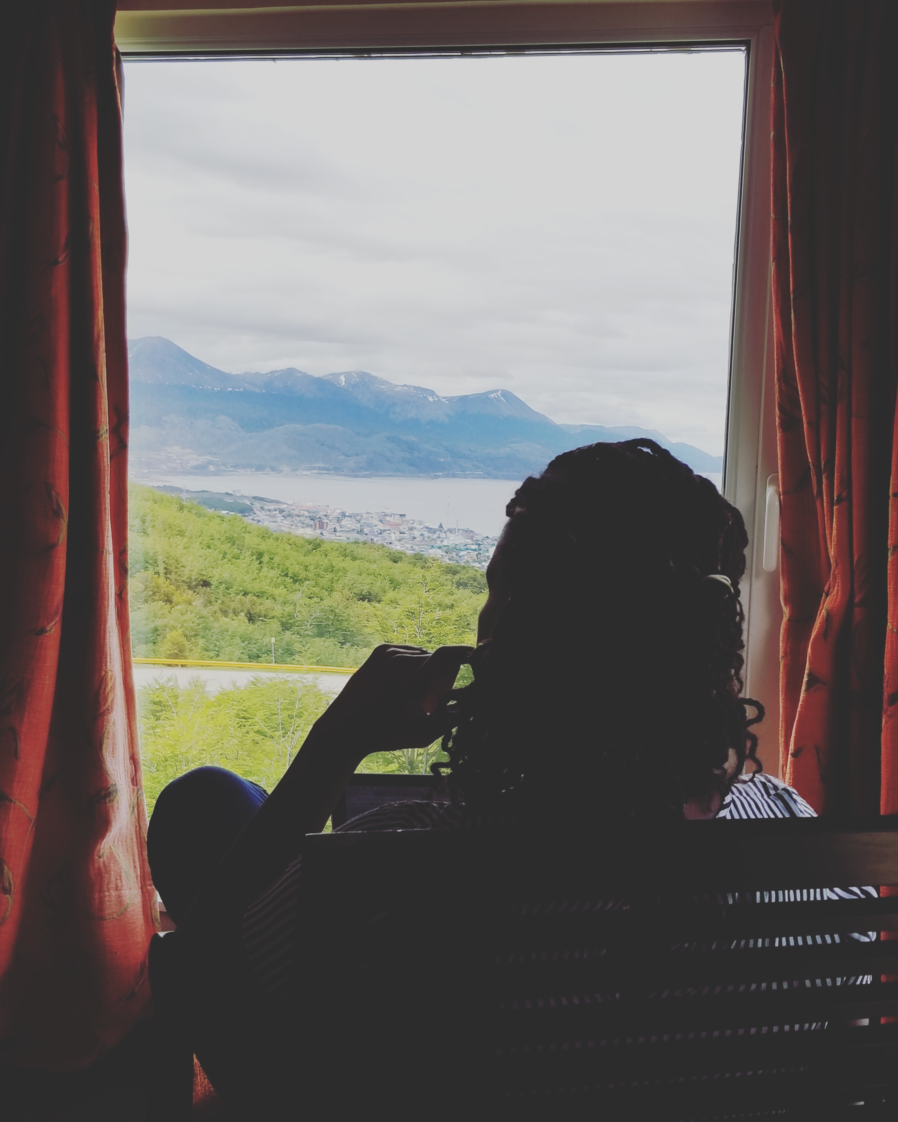 Sitting looking over the Tierra del Fuego region at Los Acebos Hotel in Ushuaia. Artistic picture for a blogger doing blogs in another country at the end of the world. CC: Christian Bieisnger