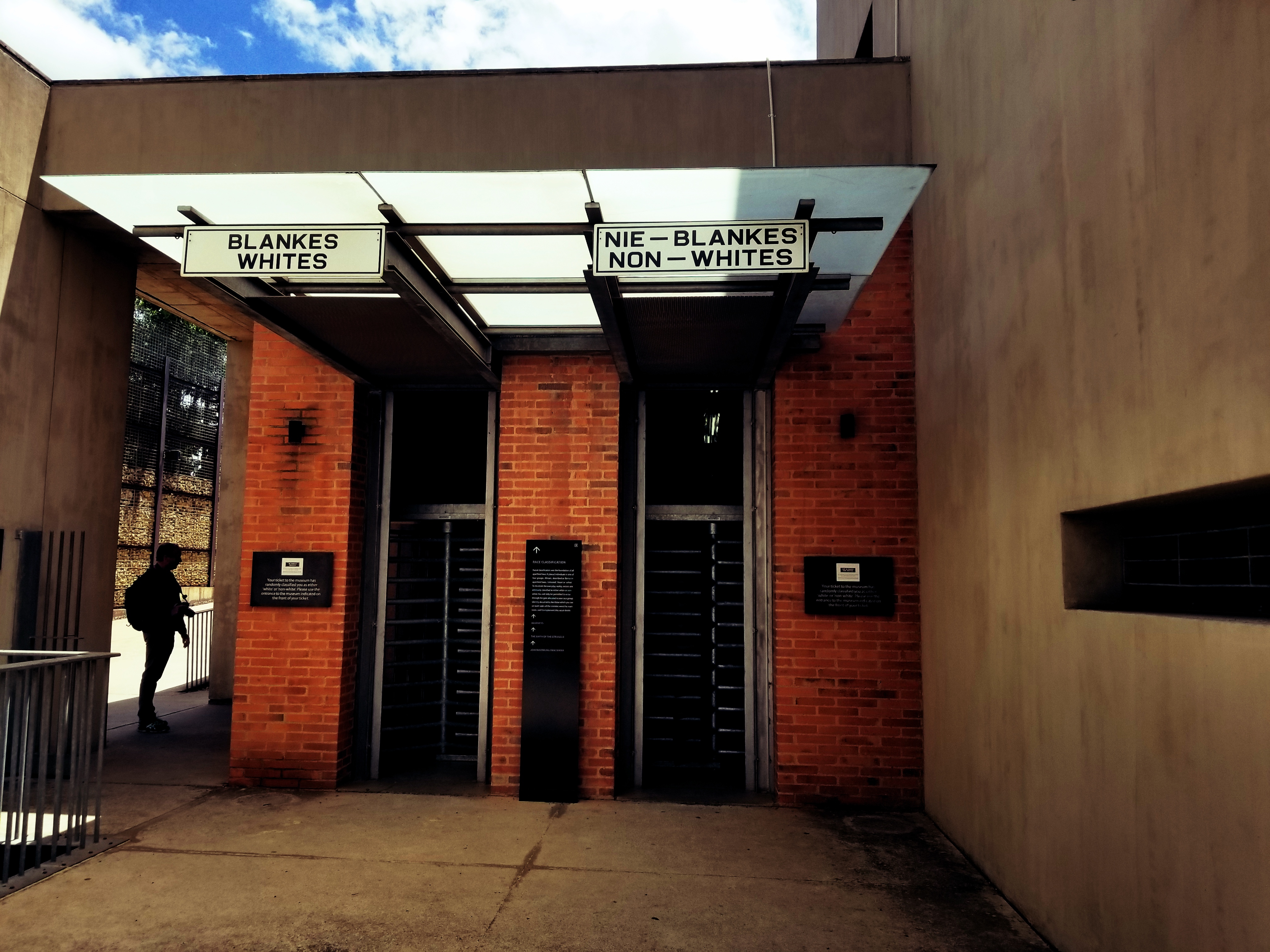 Entrance to the apartheid museum. darkened for effect. CC: Jasmine Nears. This work is licensed under a creative commons license. Cite to use.